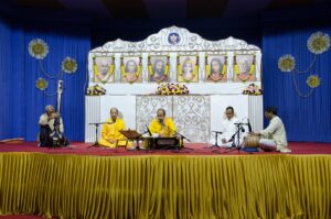 Brahmachari Achyutananda leads Cosmic Chants and bhajan during long meditation.