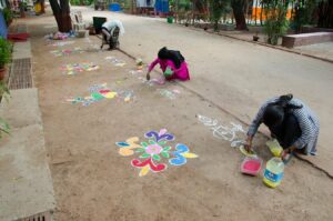 Devotees decorate grounds with colours....