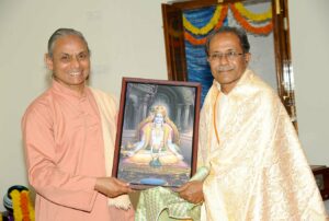 Swamiji honours one of the donors, Anantapur.