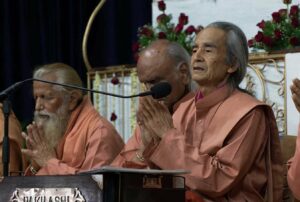 Swami Nirvanananda leads prayer during closing ceremony.