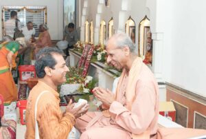 Monks distribute prasad during the closing function.