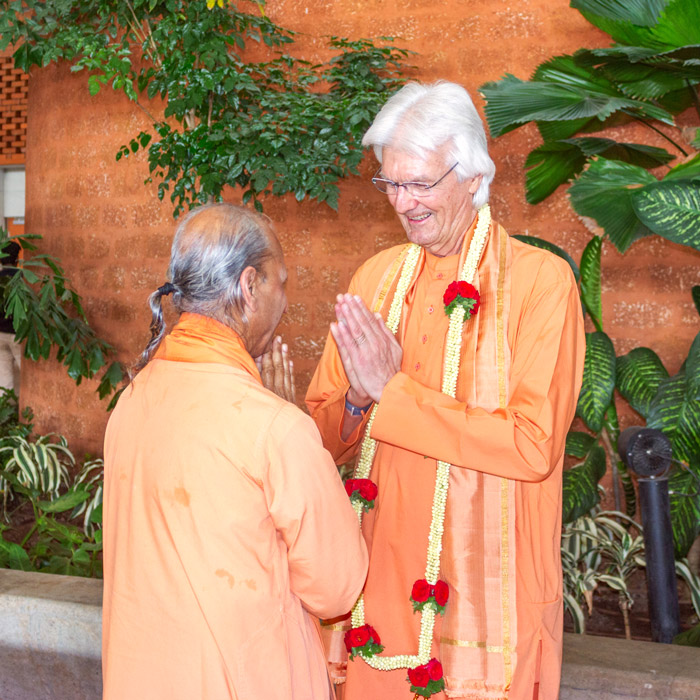 Swami Chidanandaji is welcomed by Swami Suddhananda upon his arrival in Bengaluru.