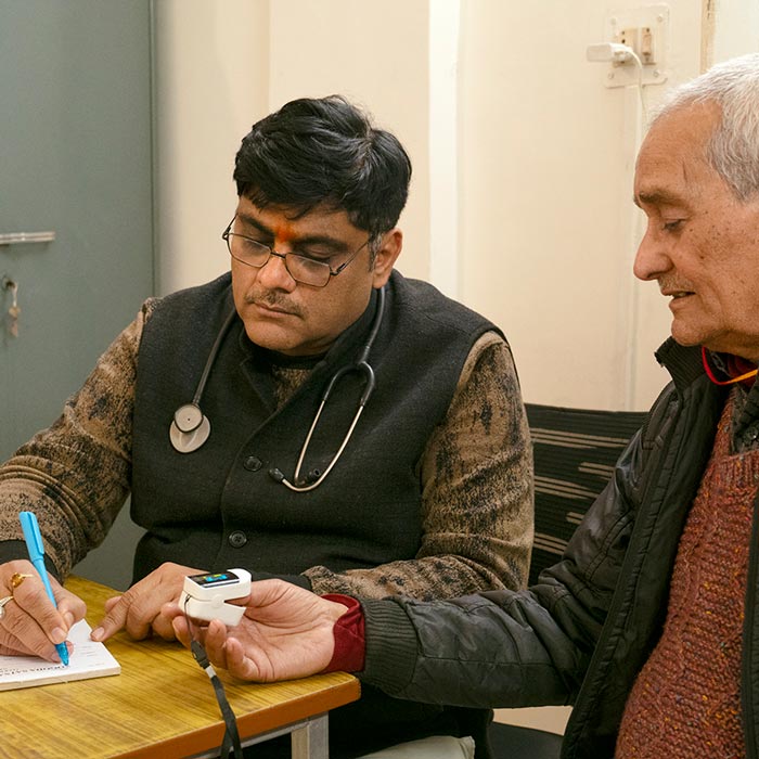 A doctor examining a patient at the Sevashrama