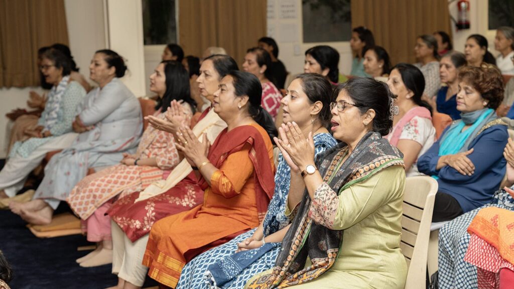 Devotees Immersed in Chanting – YSS Noida Ashram