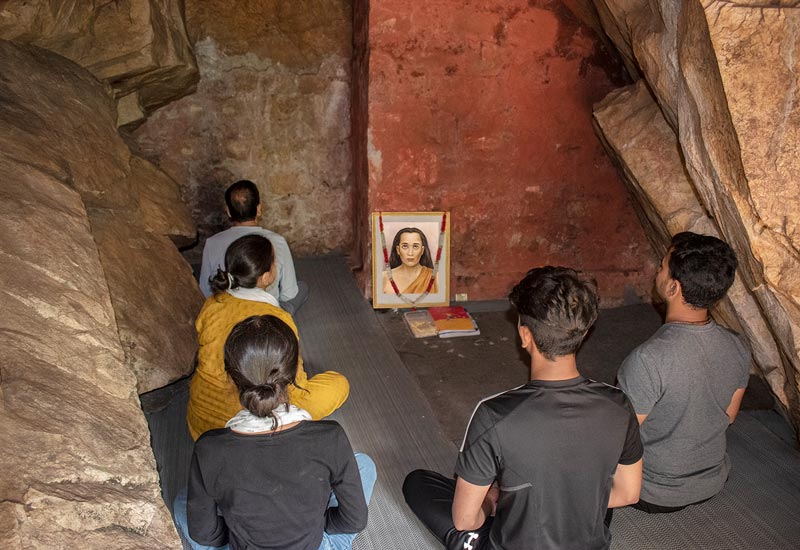 Devotees meditating in Babaji's cave