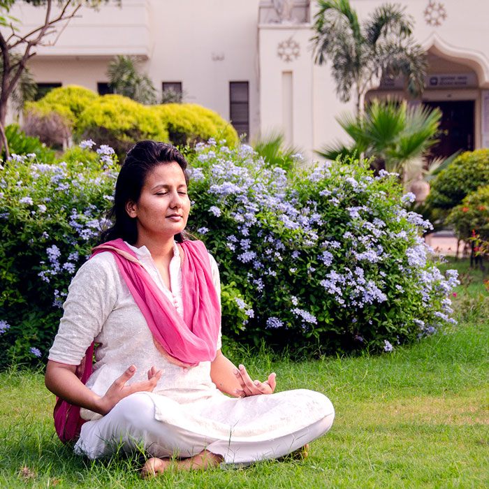 YSS Noida Ashram – Devotee Meditating in Lotus Posture